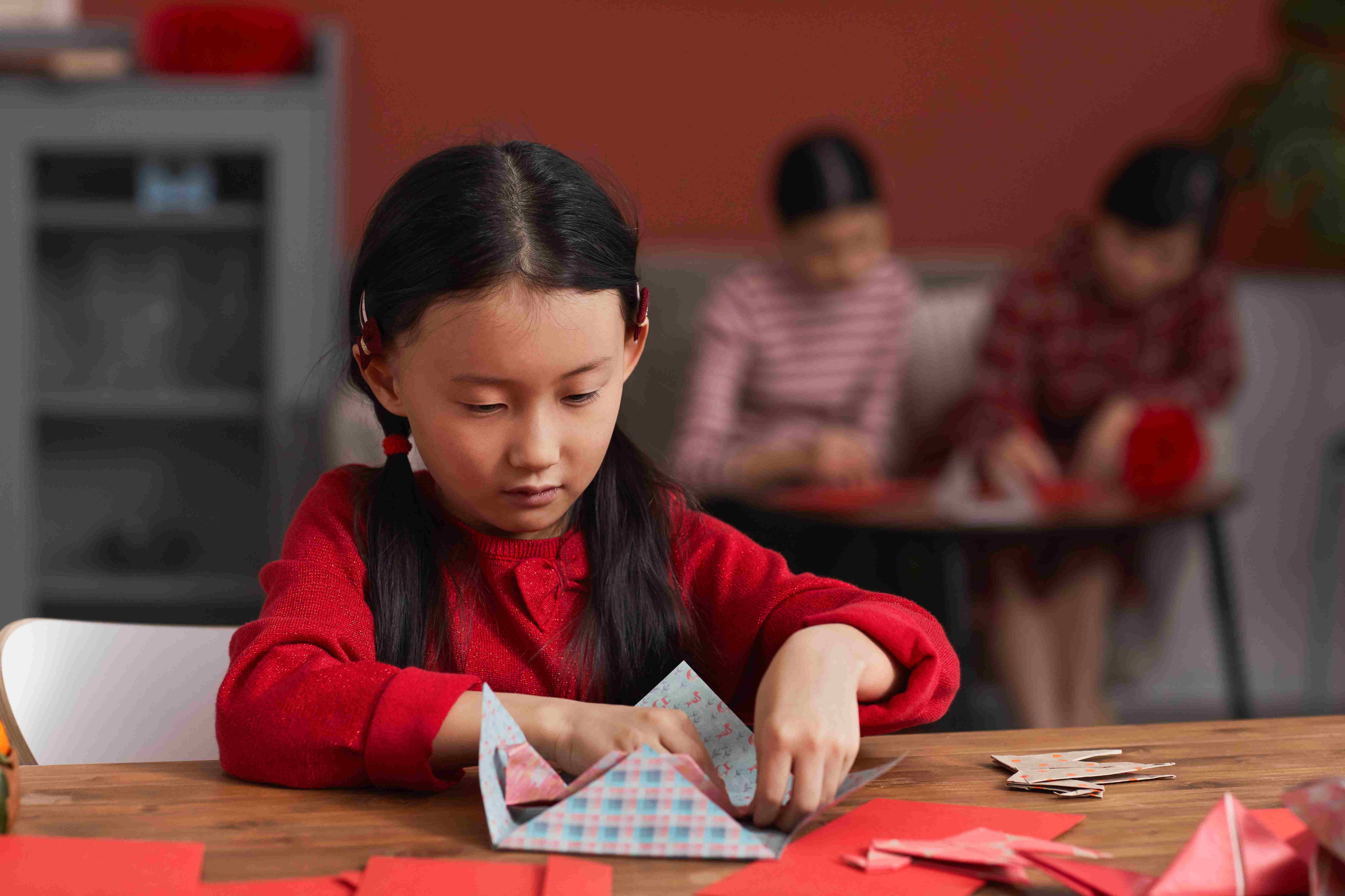 young girl doing art